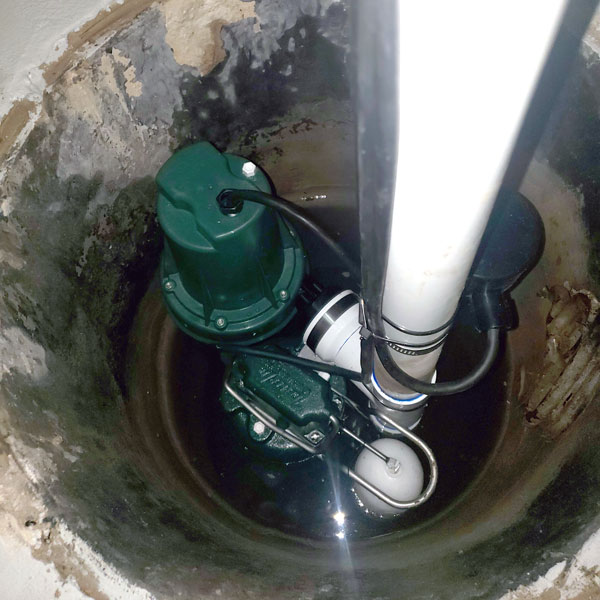 Sump pump and battery backup system installation for a Mundelein basement